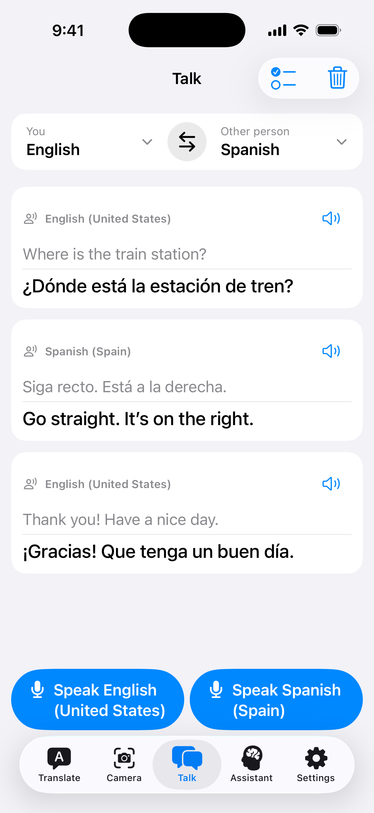 An English and Spanish Talk exchange asking for the train station and receiving directions